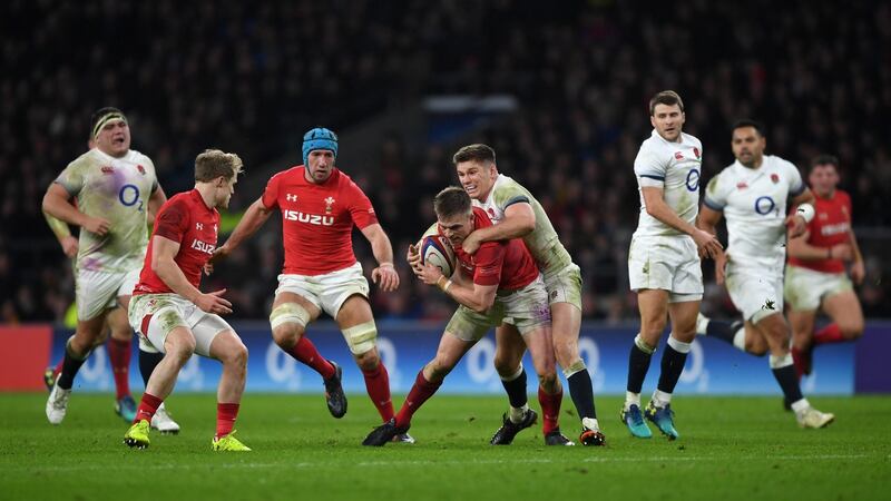 Owen Farrell tackles Gareth Anscombe. Photograph: Shaun Botterill/Getty