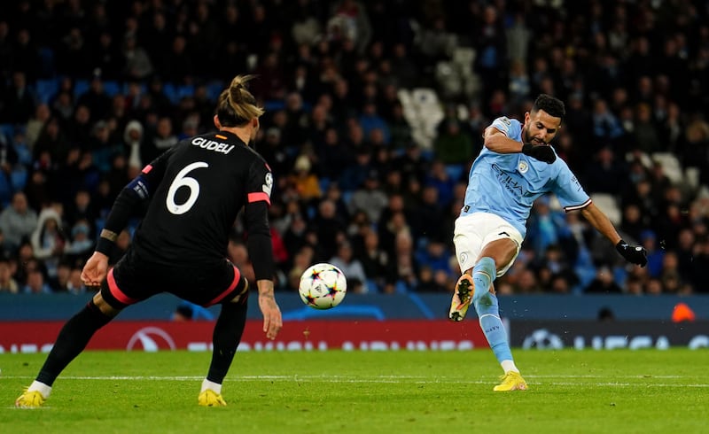 Riyad Mahrez scores City's third goal of the game against Sevilla. Photograph: PA
