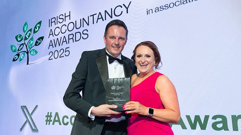 Mark Chambers, managing director, Iris, presents the transformation project of the year award to Geraldine Sheehan, Uisce Eireann