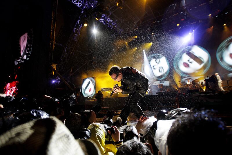 Bono on stage with U2 at Glastonbury in 2011. Photograph: Dave J Hogan/Getty