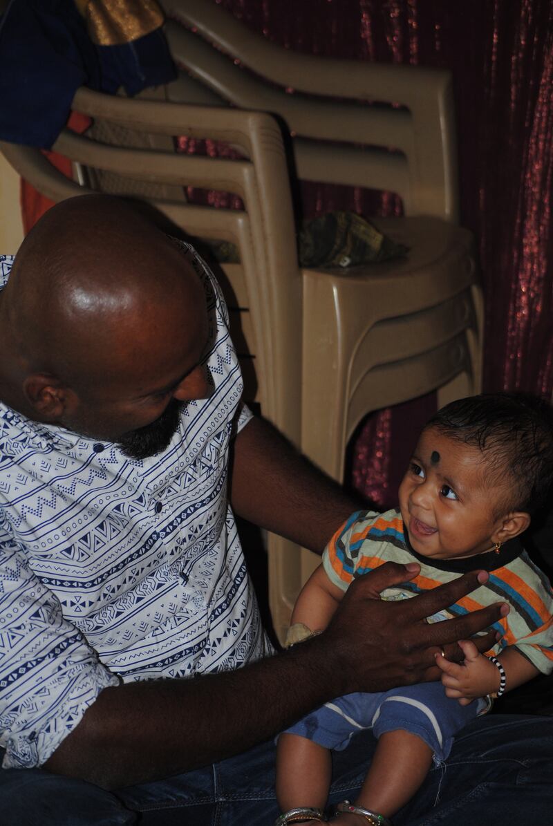 Researcher Anand Siddaiah with a young member of the Jenu Kuruba tribe in southern India. Photograph: Anand Siddaiah
