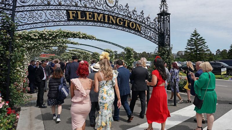 Though familiar in every sense, I’d never once walked through the famous gates of Flemington racecourse on Melbourne Cup day.  Photograph: Scott Barbour/EPA