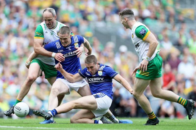 Kerry's Evan Looney and Jason Foley compete for possession with Michael Murphy of Donegal. Photograph: Laszlo Geczo/Inpho