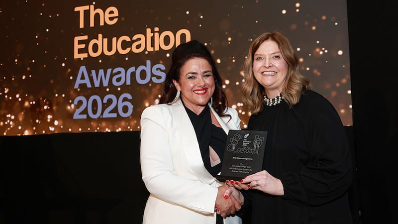 Denise McMorrow, awards judge, presents the best masters programme award to Ciara Heavin, University College Cork