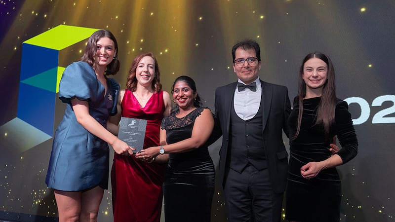 Shauna Elliott, sales and marketing at Total Fitout, presents the sustainable fit out project of the year award to the OCSC team