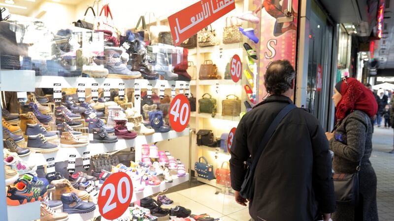 “Normality” continues:  Syrians look through a shop window at al-Salhiyah Market in Damascus, Syria, on Monday. The Syrian army is preparing for a military offensive to drive militants out of Eastern Ghouta  near Damascus. Photograph: Youssef Badawi/EPA
