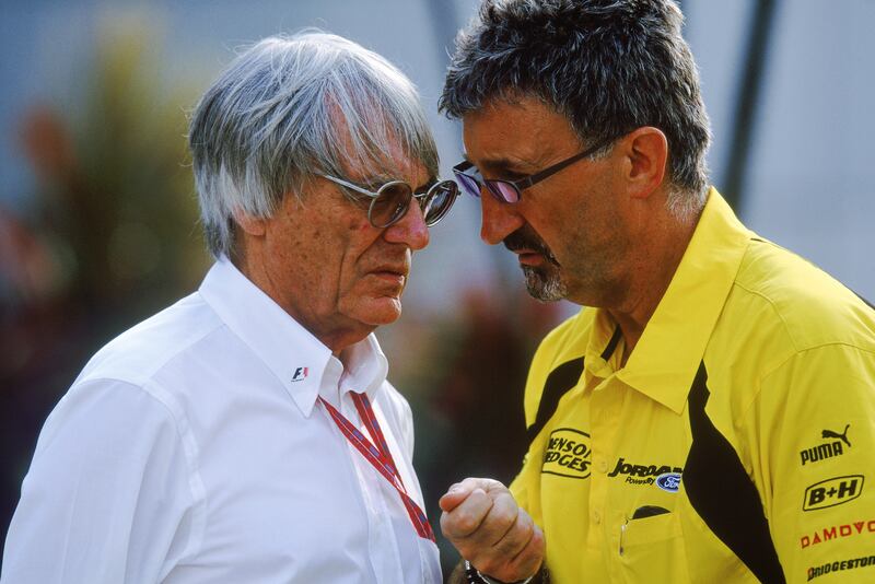 Former FIA boss Bernie Ecclestone chats to Eddie Jordan during the Malaysian Formula One Grand Prix in 2003. Photograph: Clive Rose/Getty