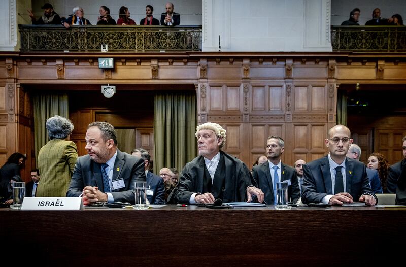 Israel's legal counselor of the Ministry of Foreign Affairs Tal Becker, lawyer Malcolm Shaw, and Gilad Noam, deputy attorney-general for international affairs, at the International Court of Justice. Photograph: Remko De Waal/ANP/AFP via Getty Images