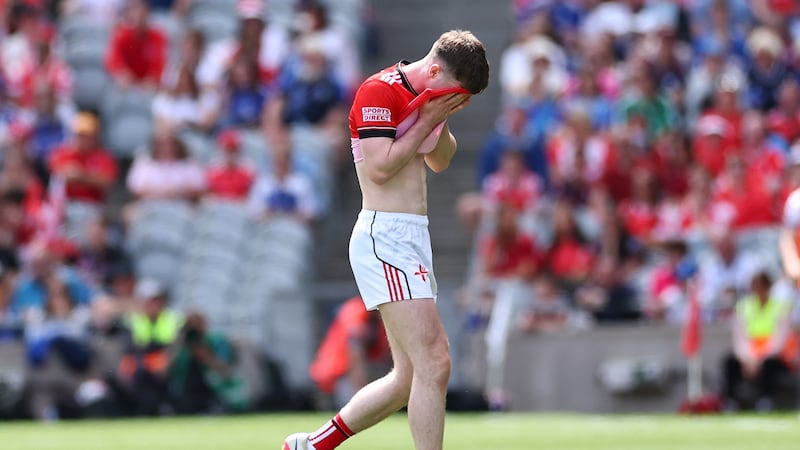 Louth’s Sean Callaghan leaves the field after receiving a straight red card early in Sunday's quarter-final against Monaghan. Photograph: James Crombie/Inpho
