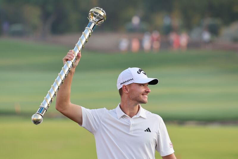 Denmark's Nicolai Hojgaard with the winner's trophy after his victory in the DP World Tour Championship European Tour at Jumeirah Golf Estates in Dubai. Photograph:  Giuseppe Cacace/AFP via Getty Images