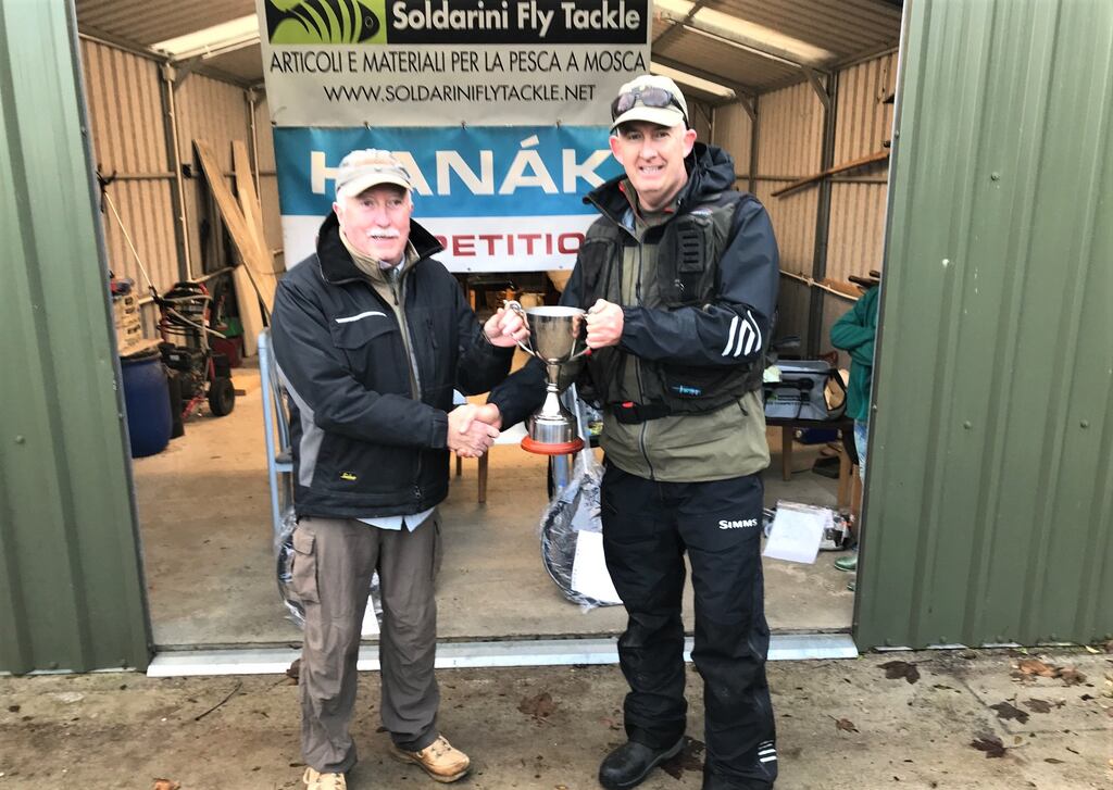 Waterford Trout Anglers chairman William Hanrahan presenting the Knockaderry Cup to winning angler, Mark Rogan