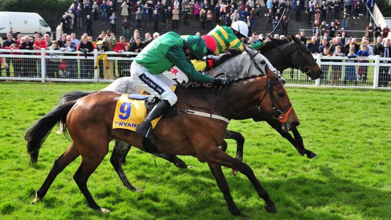 Gilgamboa ridden by Tony McCoy gets his nose in front over the last on the way to winning the  Ryanair Gold Cup  at Fairyhouse. Photograph:  Pat Healy/PA