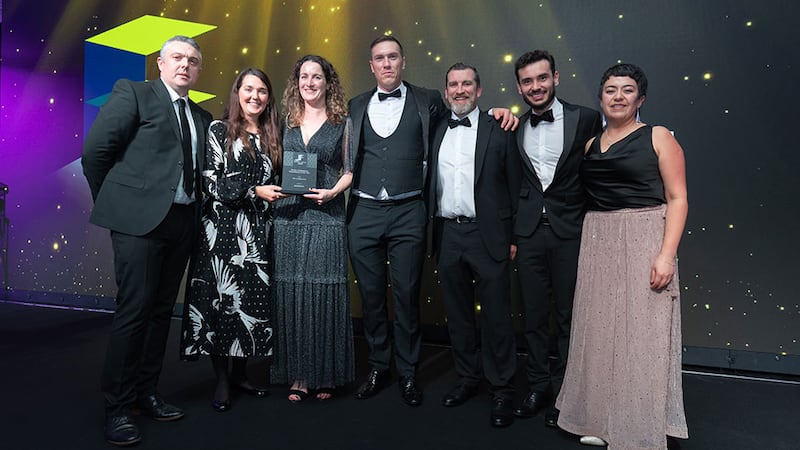 Hugh Ward, director of interiors at Ardmac, presents the fit out professional consultancy of the year award to Ethos Engineering team