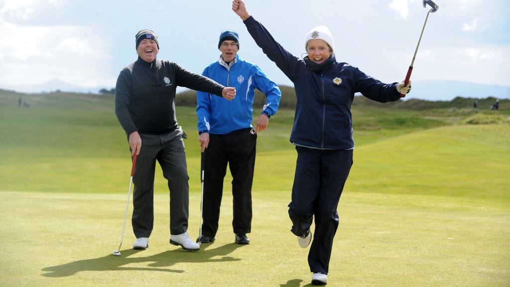 Castle Golf Club club captain Joe O’Hare and president Eamonn Duggan watch lady captain Carina Staunton in action during  the Allianz/Irish Times Golf Challenge. Photograph: Aidan Crawley