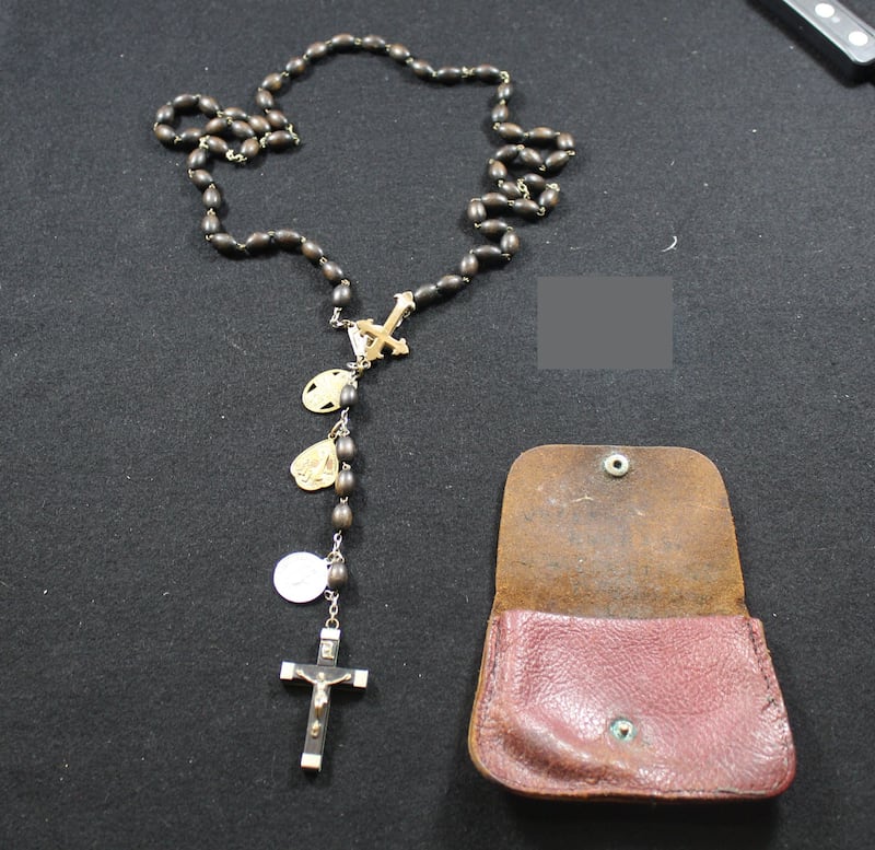 A pouch and rosary beads belong to Patrick Joseph (PJ) Hughes who landed with the Royal Ulster Rifles on D-Day. Hughes was also a survivor of the first World War.