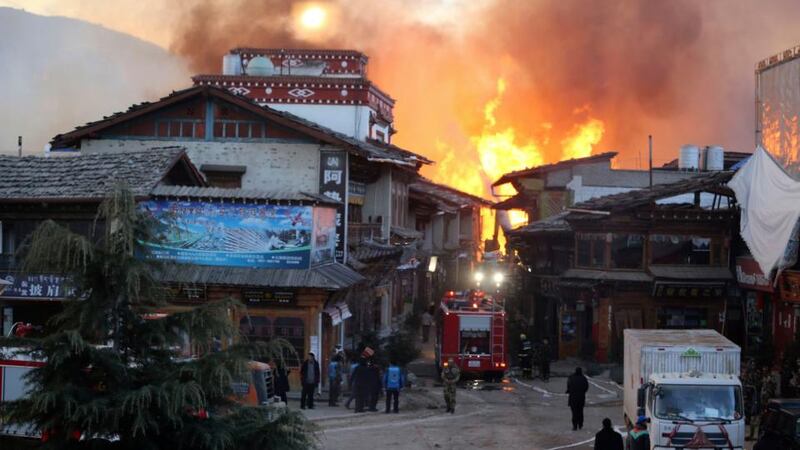 Firefighters battle a blaze  at the Dukezong Ancient Town in Shangri-la county, Yunnan province. Photograph: Reuters