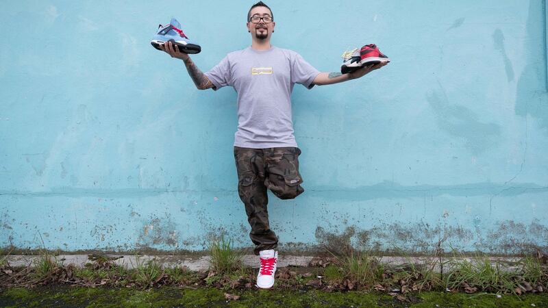 Cliff Mann at home in Shannon, Co Clare with some of his collection of sneakers. Photograph: Eamon Ward