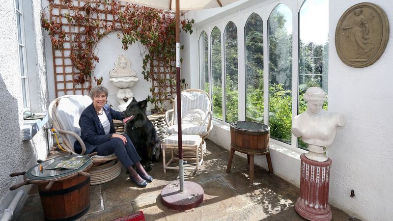 Ann Henning Jocelyn with her Black German Shepherd Pushkin in the conservatory at her house in Doonreagan, Connemara. Photograph: Joe O’Shaughnessy