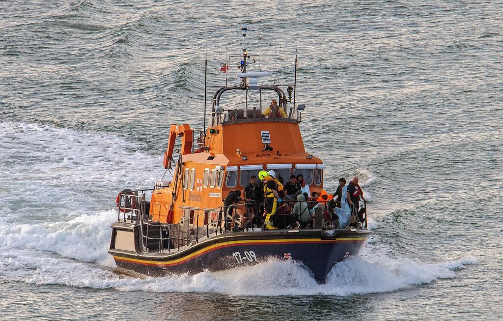 At least six people died and at least 58 – many of them Afghans – were rescued after a boat got into difficulty of the coast of Sangatte on Saturday. Photograph: Stuart Brock/Getty Images