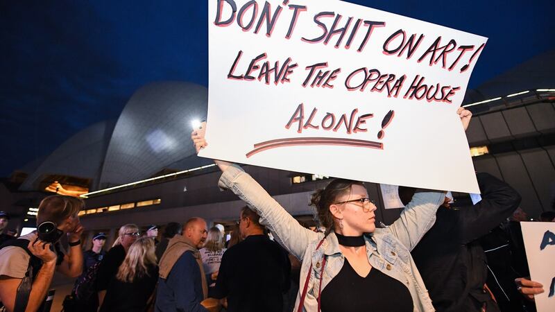 Demonstrators  protest against the decision to project an ad for NSW Racing’s multi million dollar race, The Everest, onto the sails of the Sydney Opera House. Photograph: EPA