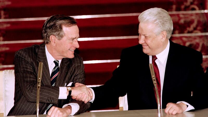 A file photo taken from January 3rd, 1993, showing the then  US president George Bush (left) and Russian president Boris Yeltsin  shake hands after signing a historical strategic arms reduction treaty in Moscow. Photograph: Getty