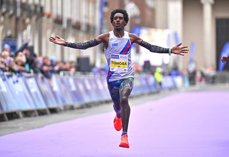 Hiko Tonosa celebrates on his way to winning the Irish National Championships and finshing third overall during the 2024 Dublin Marathon in October. Photograph: Sam Barnes/Sportsfile
