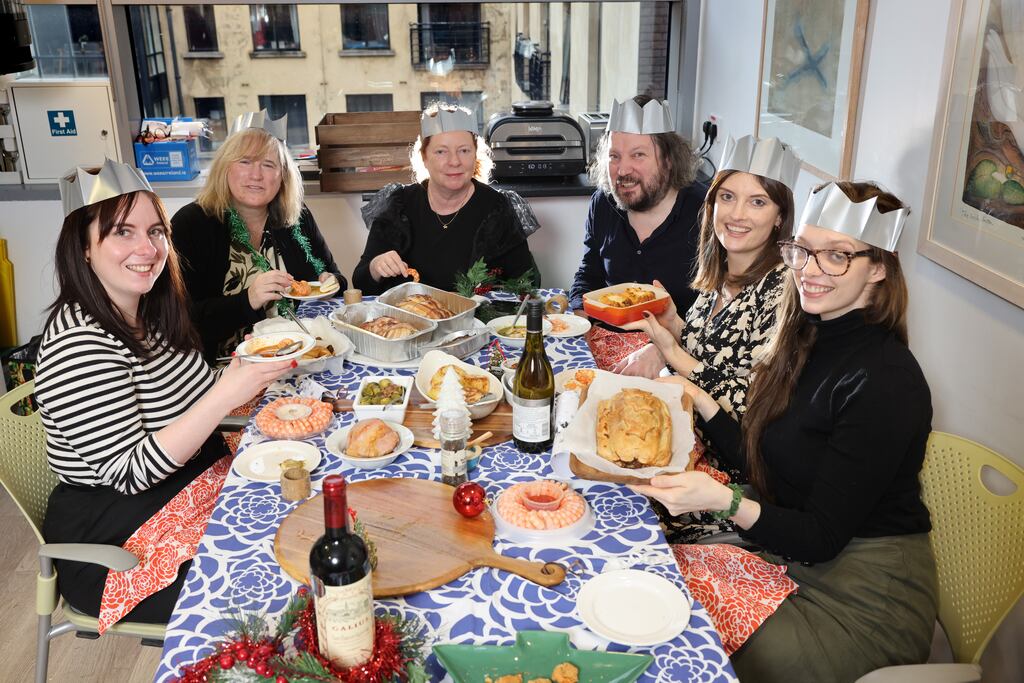 The Irish Times taste testers Jessica Doyle, Deirdre Falvey, Rosita Boland, Patrick Freyne, Ciara Kenny and Jennifer Cosgrove tucking into their Christmas dinner which came entirely from the freezer aisles. Photograph: Dara Mac Dónaill