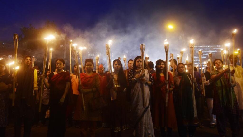 Bangladeshi secular activists take part in a torch-lit protest against the killing of US blogger of Bangladeshi origin, Avijit Roy. Photograph: AFP Photo
