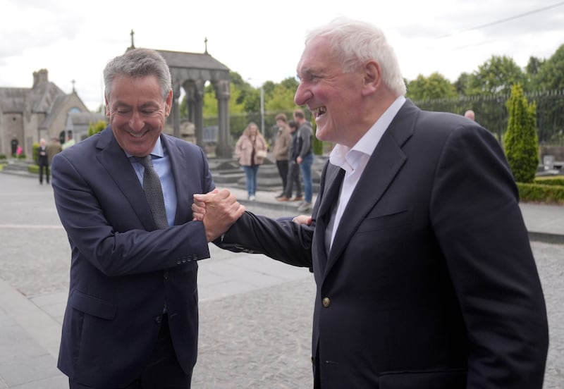 Billy Kelleher greets Bertie Ahern during an event commemorating the 50th anniversary of Éamon de Valera's death, at Glasnevin Cemetery, Dublin. Photograph: Brian Lawless/PA Wire
