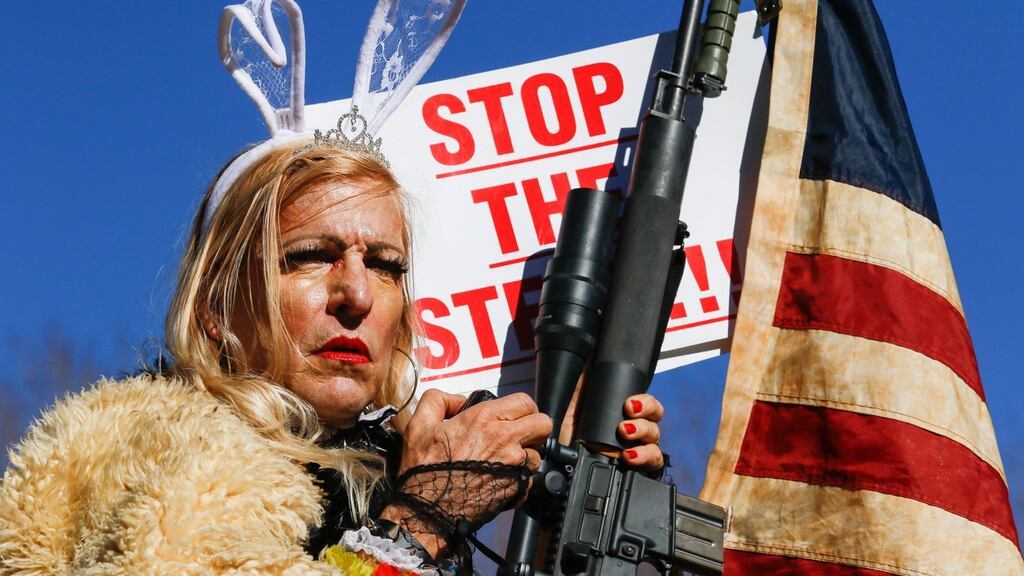 A protester going by the name Cowboy Barbie holds an AR-15 rifle at a rally in Carson City, Nevada, in January ahead of Joe Biden’s inauguration as US president. Photograph: Ty O’Neil/Sopa Images/LightRocket via Getty Images