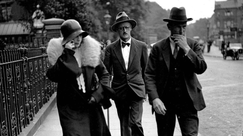July 4th, 1931: Nora Barnacle (trying to hide her face) and James Joyce, centre, after their Kensington register office wedding. Photograph: Popperfoto/Getty