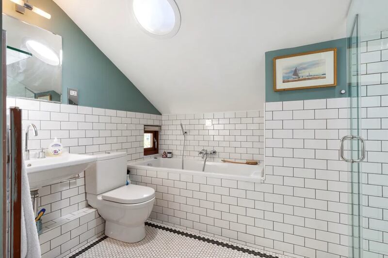 Bathroom with small window above the bath