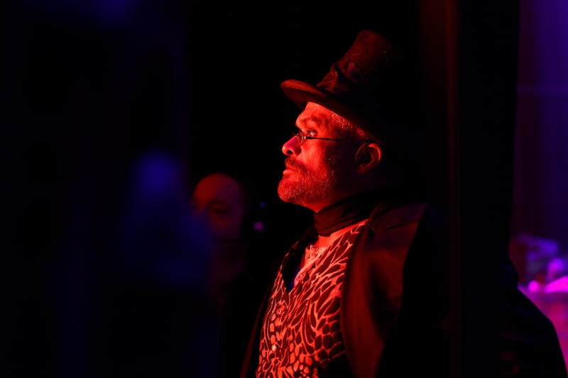 Moulin Rouge! The Musical: A costumed cast member's face and waistcoat reflect the stage lights. Photograph: Nick Bradshaw