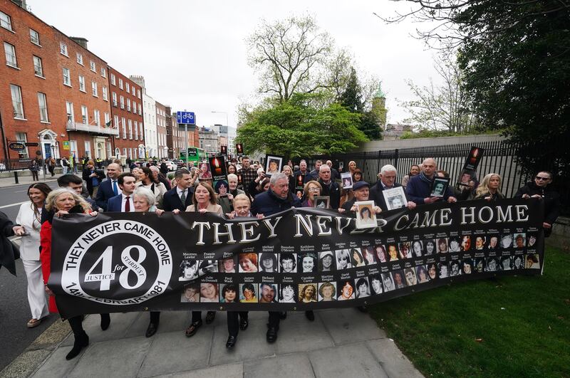 Stardust survivors, family members and supporters walk to the Garden of Remembrance. Photograph: Brian Lawless/PA Wire