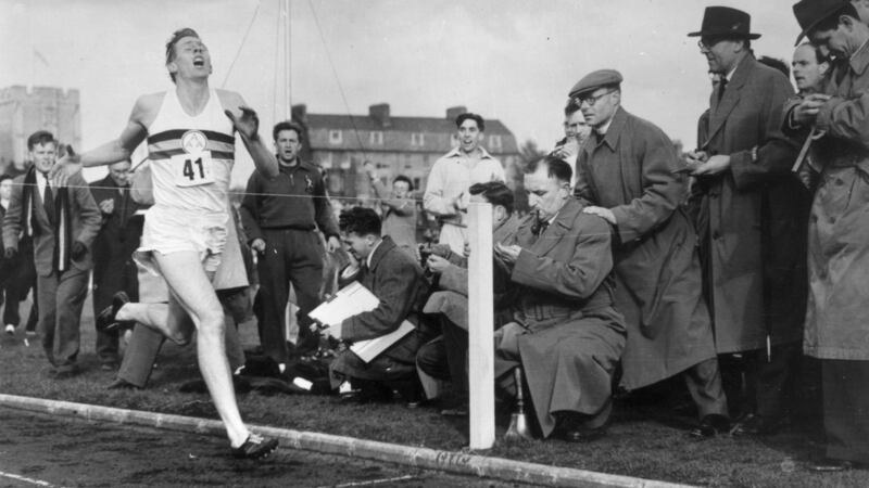 Roger Bannister at the finish line of his record-breaking mile run at Iffley Road, Oxford, in 1954. Photograph: Norman Potter/Central Press/Getty 