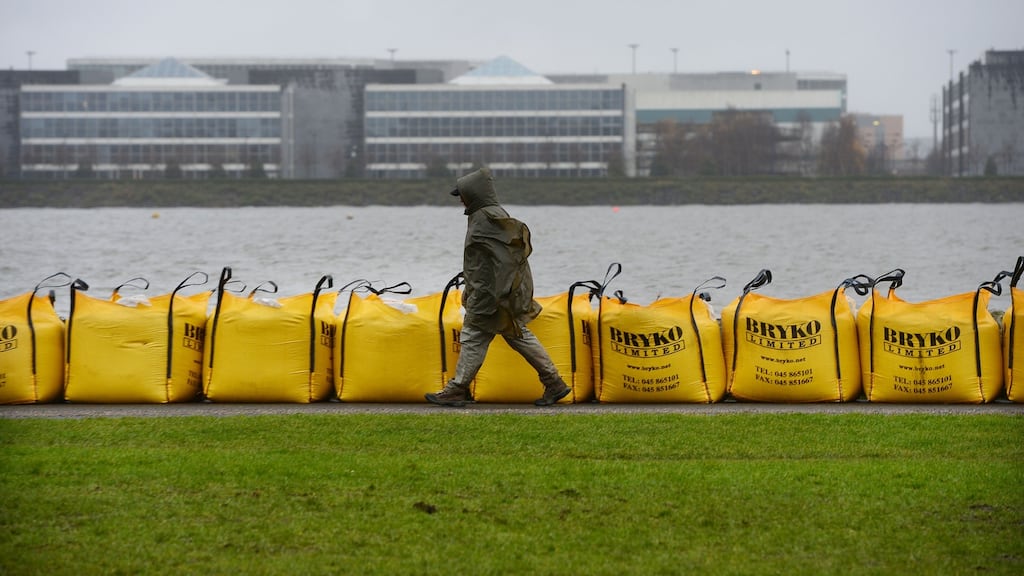 Large yellow sandbags have been left in place along the Clontarf Road following flooding. Photograph: Alan Betson