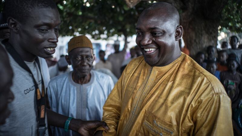 The flag-bearer of the coalition of the seven opposition political parties in Gambia Adama Barrow is greeted by supporters at a gathering in Jambur. Photograph: Marco Longari/AFP/Getty Images
