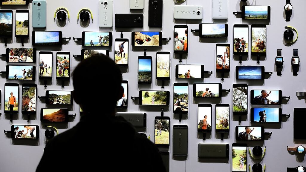 In the dark: How did a company most people have never heard of come to lay claim to elements found in virtually every smartphone? Photograph: Justin Sullivan/Getty Images