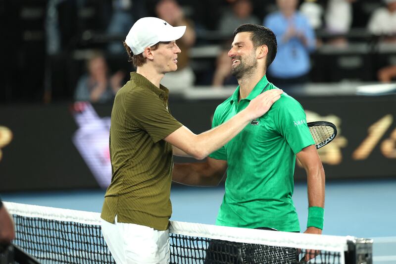 Serbia's Novak Djokovic embraces Italy's Jannik Sinner after their men's singles semi-final match. Photograph: Martin Keep/Getty