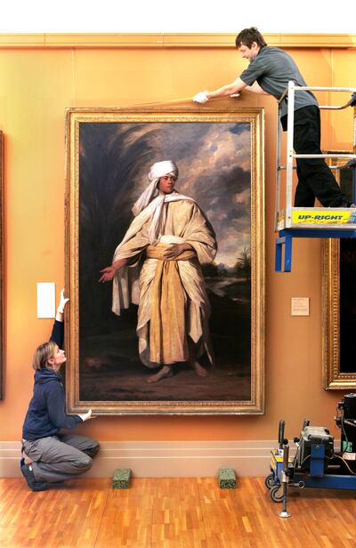 Sir Joshua Reynolds' Portrait of Omai being prepared for public viewing by Kevin Kelly and Sheila Dooley at the National Gallery in 2006. Photograph: Matt Kavanagh
