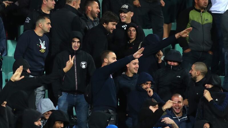 Bulgarian fans can be seen making right-arm salutes during the game which was marred by racist abuse. Photo: Catherine Ivill/Getty Images