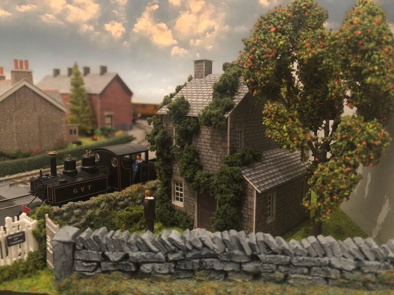 The driver of the narrow gauge train waves to the new owner of the crossing keeper’s cottage. Photograph: Glen Murphy