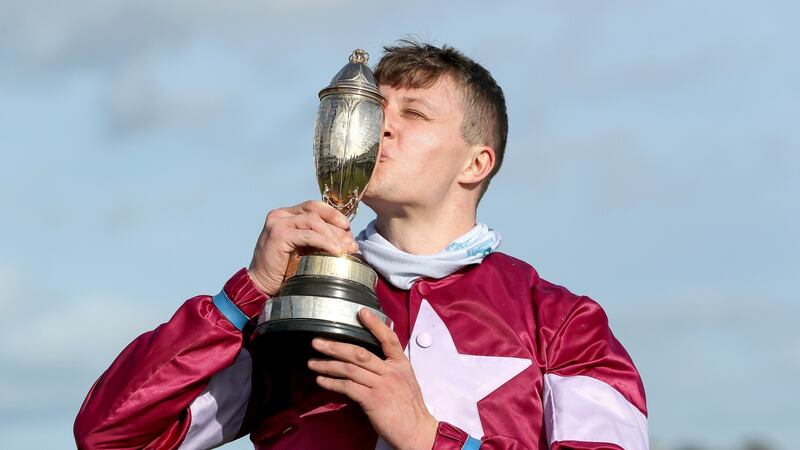 Shane Fitzgerald’s celebrates with the trophy after his win on Assemble in the Guinness Kerry National Handicap Chase in Listowel. Photograph:  Bryan Keane/Inpho