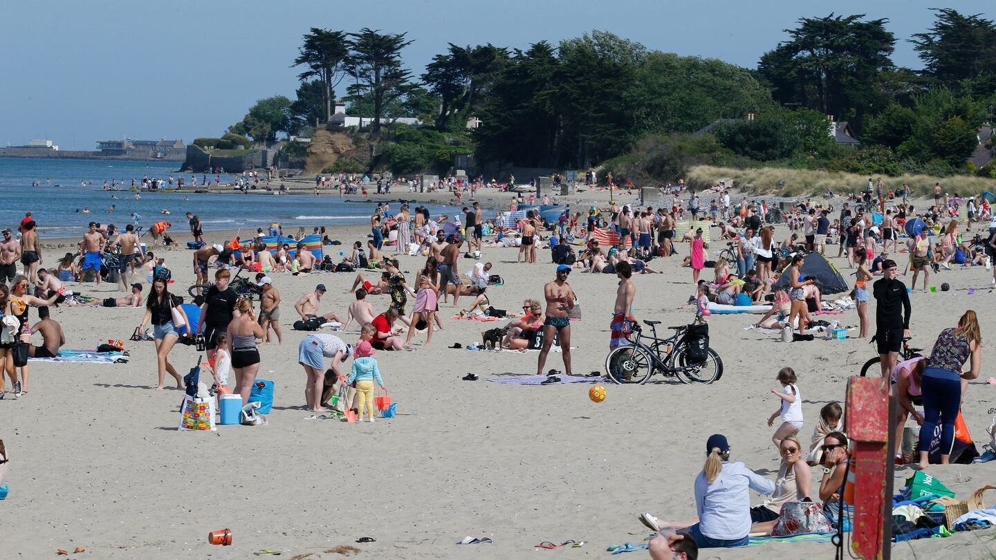 Crowds enjoying the sun on Burrow Beach, Sutton. Photograph: Crispin Rodwell