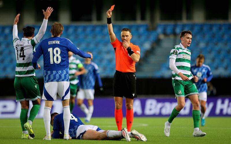 Referee Andris Treimanis shows a red card to Valdemar Lund of Molde. Photograph: Ryan Byrne/Inpho