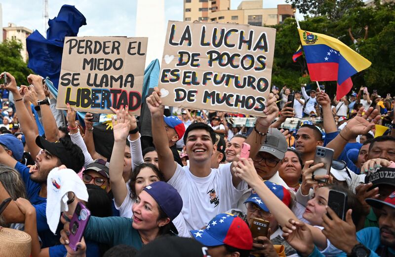 supporters of Venezuelan opposition presidential candidate Edmundo Gonzalez Urrutia and opposition leader Maria Corina Machado attend a campaign a rally in Maracaibo, Zulia state, Venezuela on July 23, 2024. Venezuela will hold presidential elections on July 28, 2024. (Photo by Raul ARBOLEDA / AFP) (Photo by RAUL ARBOLEDA/AFP via Getty Images)