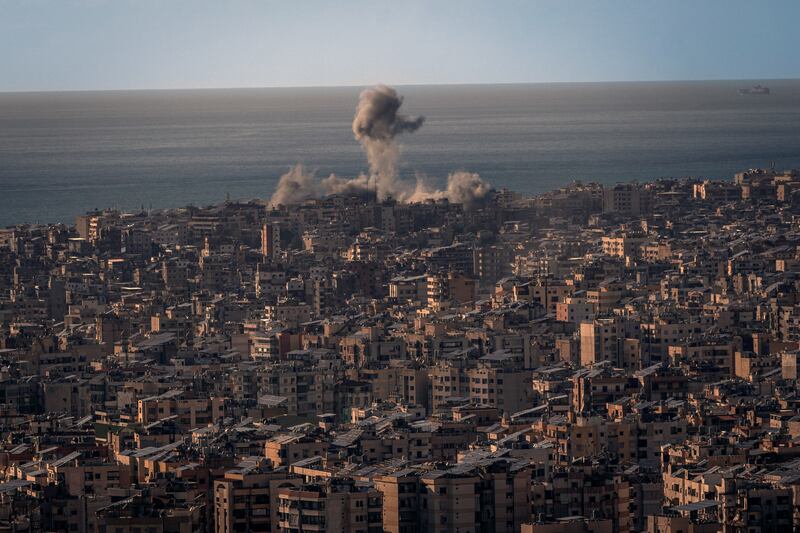 A plume of smoke rises after an air strike in Dahiyeh, a suburb south of Beirut, Lebanon, on Tuesday. Photograph: Diego Ibarra Sanchez/The New York Times
                      
