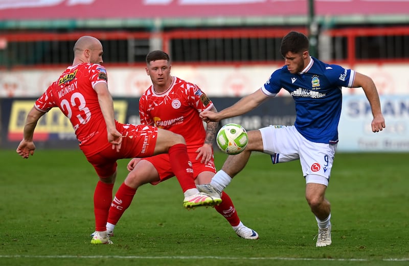 Linfield's Kieran Offord is challenged by Shelbourne's Kerr McInroy and Kameron Ledwidge. Photograph: Charles McQuillan/Getty Images