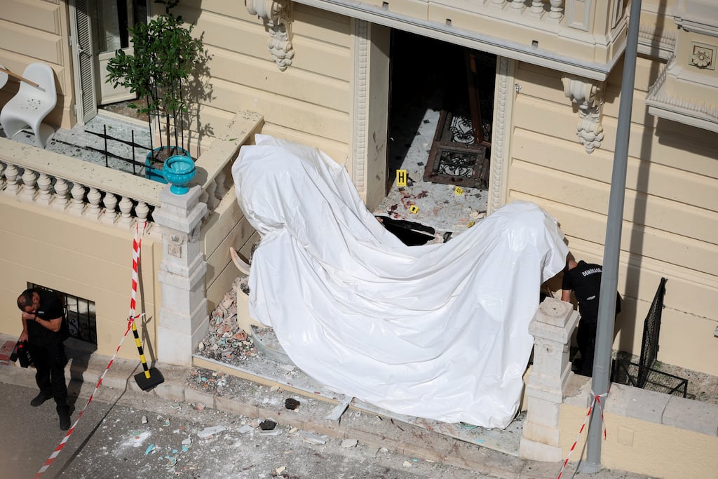 Members of a bomb disposal team operate the day after an alleged attack involving an explosive device in the lobby of a residential building in Monaco. Photograph: Valery Hache/AFP/Getty Images