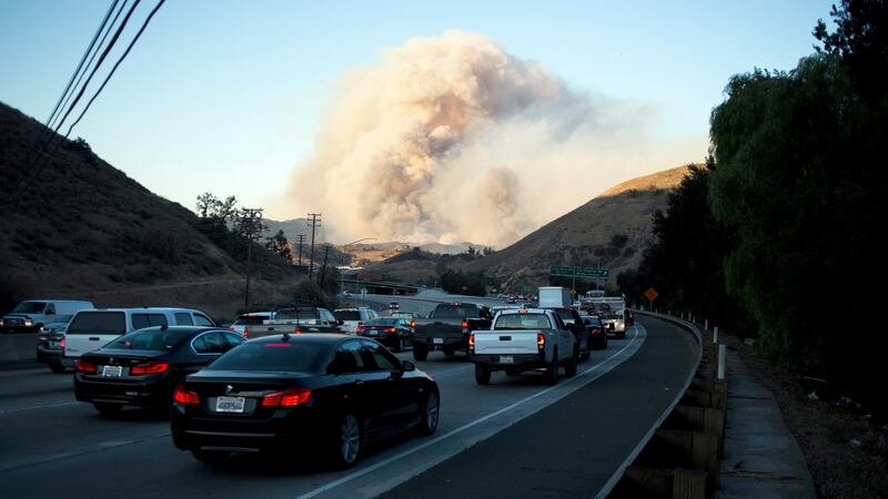 Smoke from the Woolsey Fire looms above Highway 101 in Thousand Oaks, California. Photograph: Jenna Schoenefeld/The New York Times